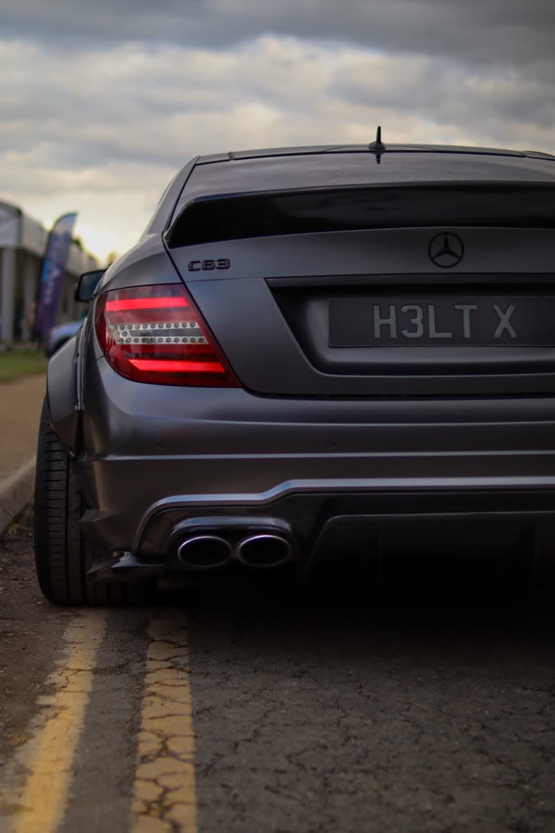 Matte black Mercedes-AMG C63, rear view